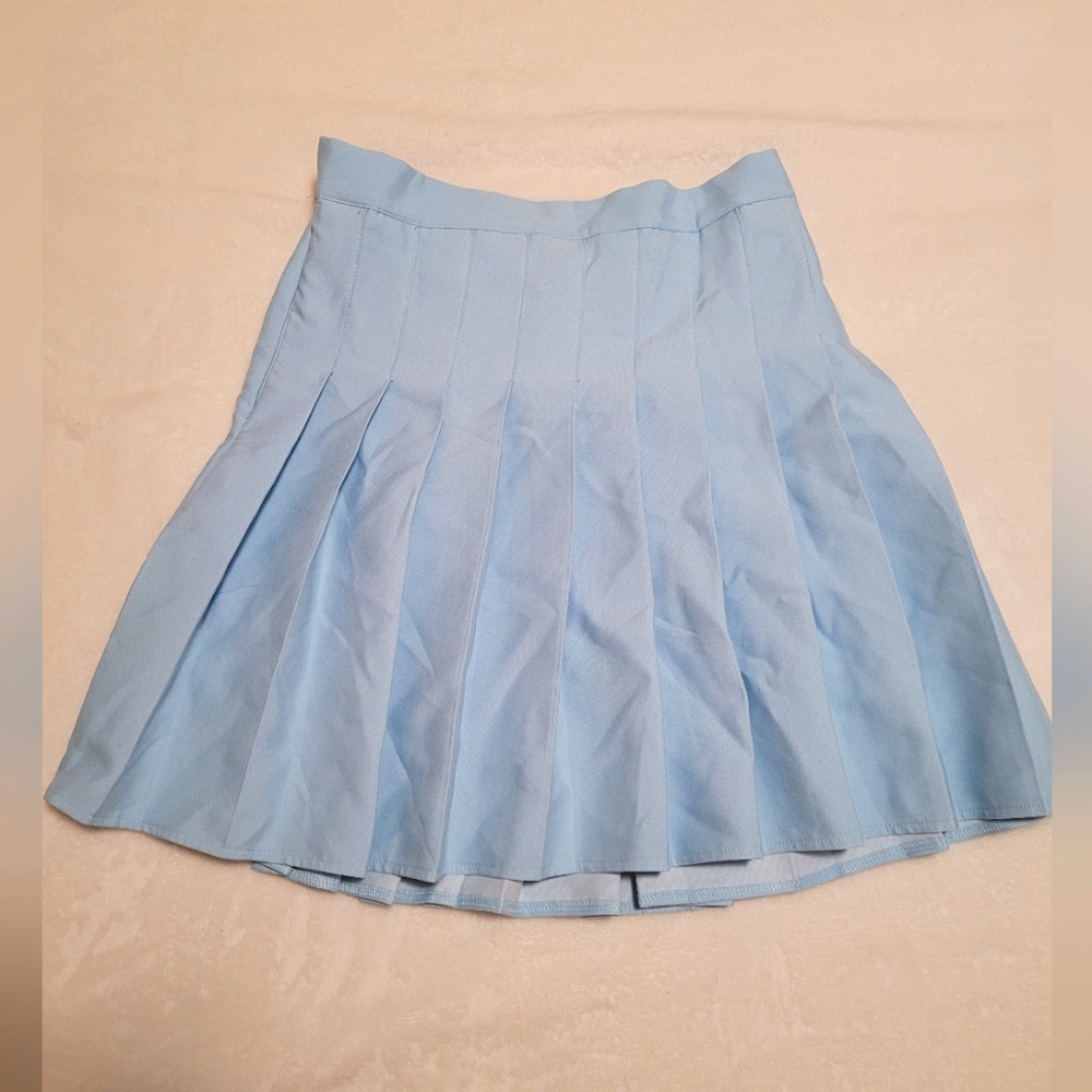 Light blue pleated mini skirt with built in shorts and elastic waistband
